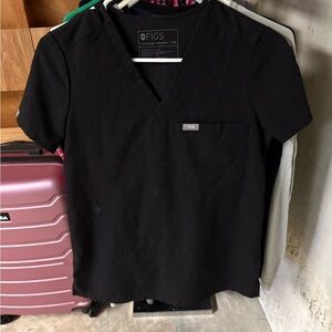 FIGS woman’s scrub tops, jogger pants, and undershirts